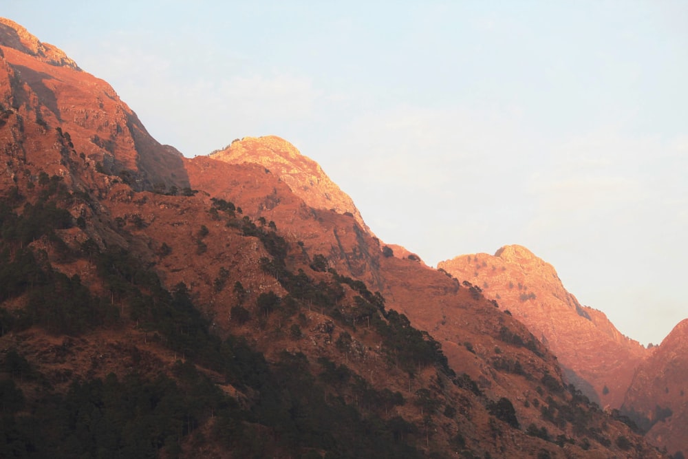 brown rocky mountain under white sky during daytime