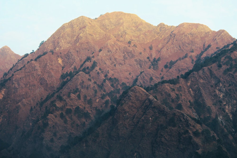 brown and green mountain under blue sky during daytime