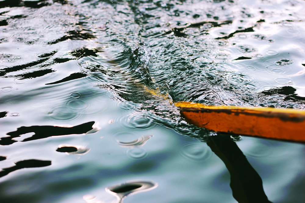 brown wooden boat on water