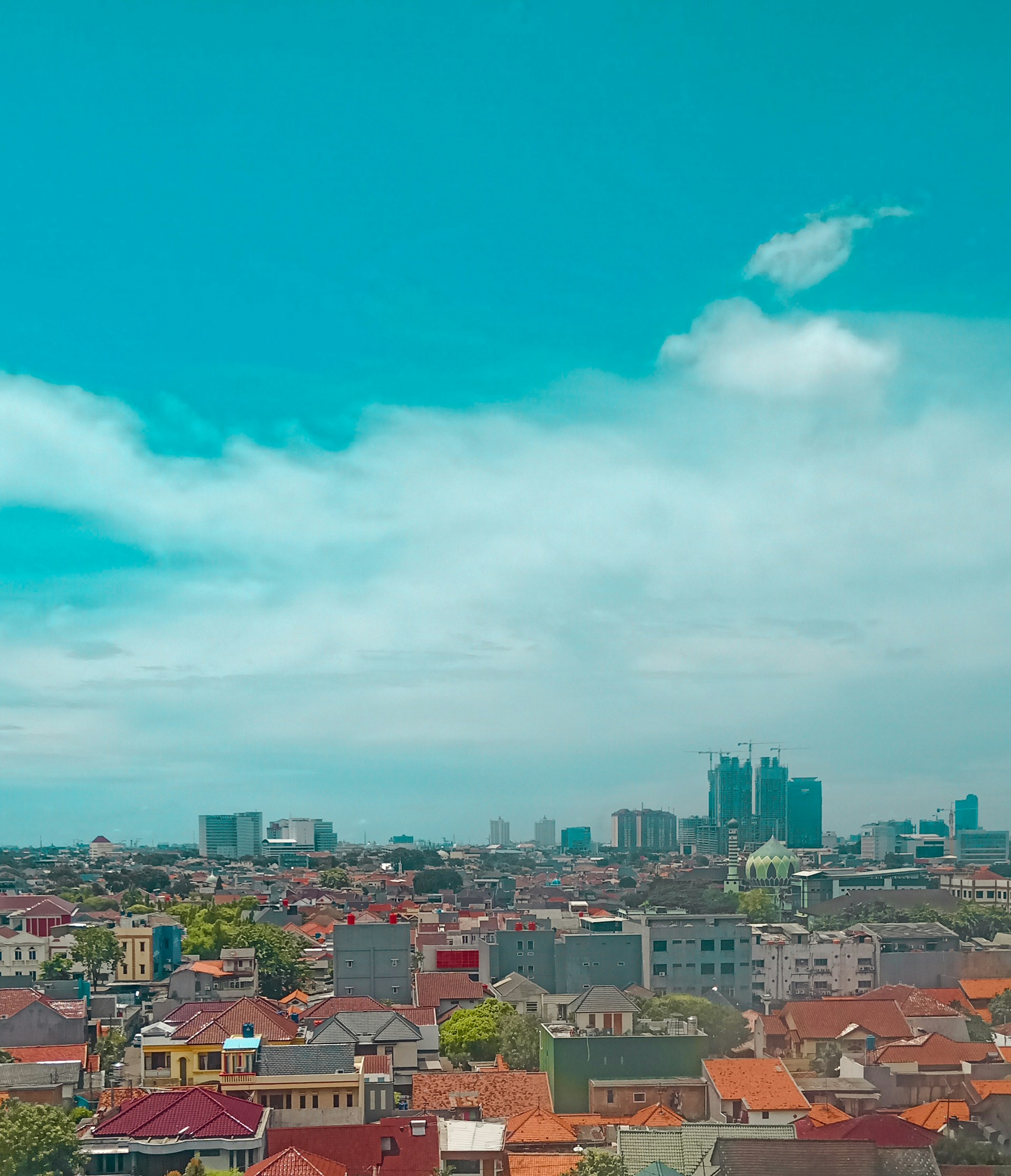 woman wearing yellow long-sleeved dress under white clouds and blue sky during daytime