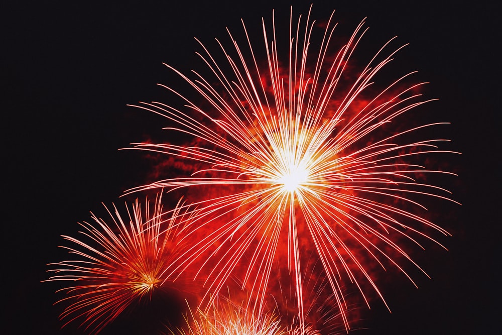 red and yellow fireworks during nighttime