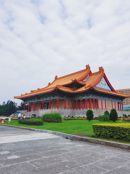 orange and white concrete building in National Chiang Kai-shek Memorial Hall Taiwan