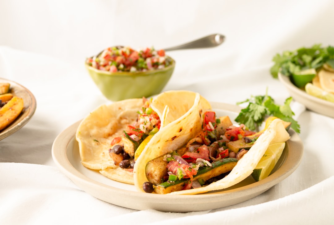 vegetable salad on white ceramic plate, Vegan zucchini and black bean tacos