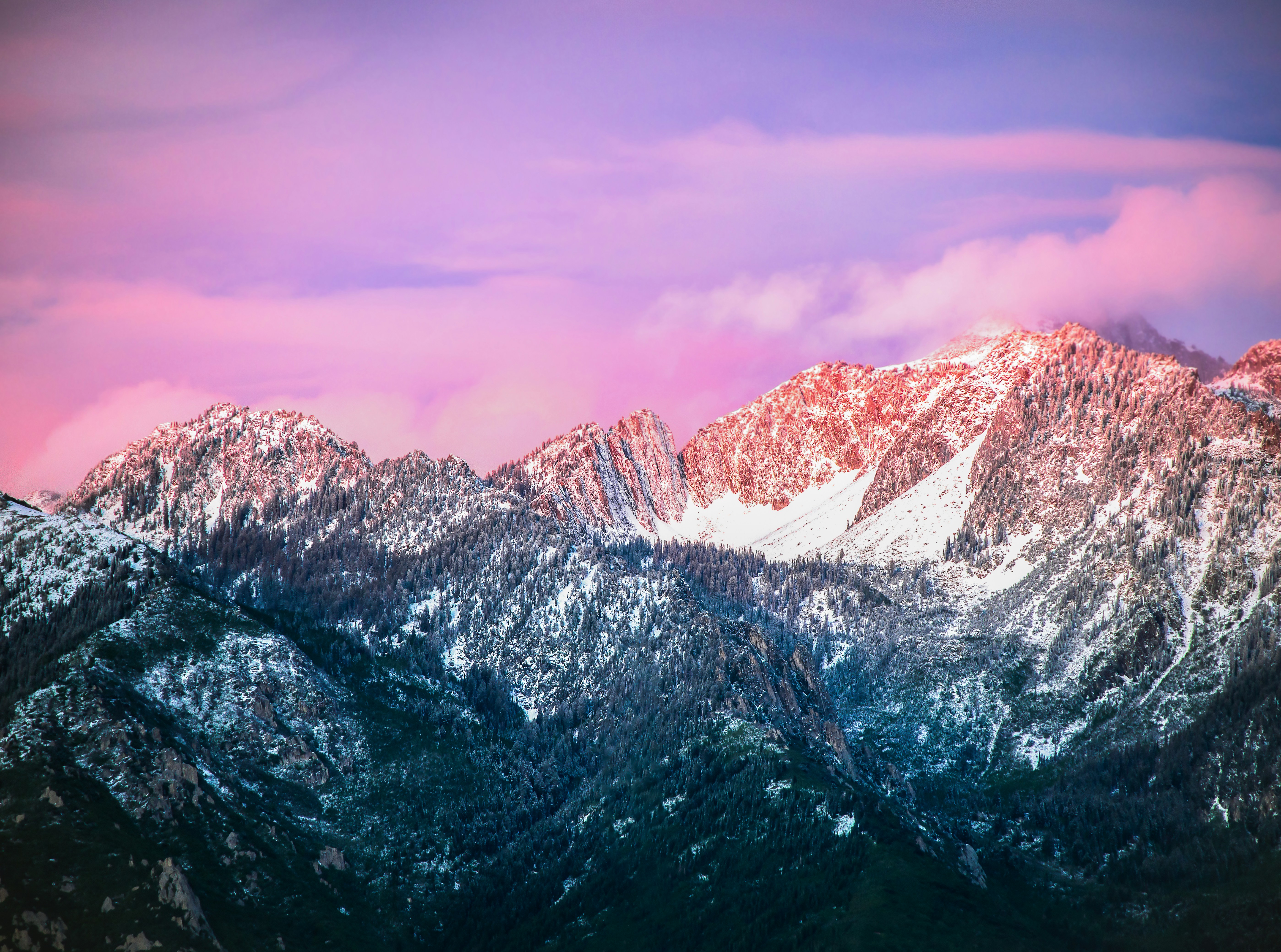 snow covered mountain under cloudy sky during daytime, A Rocky Mountain sunset after a June snow storm