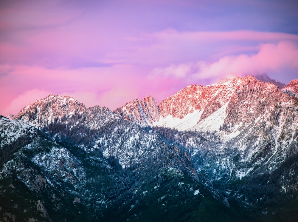 snow covered mountain under cloudy sky during daytime