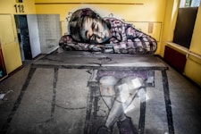 woman in black and white long sleeve shirt lying on couch