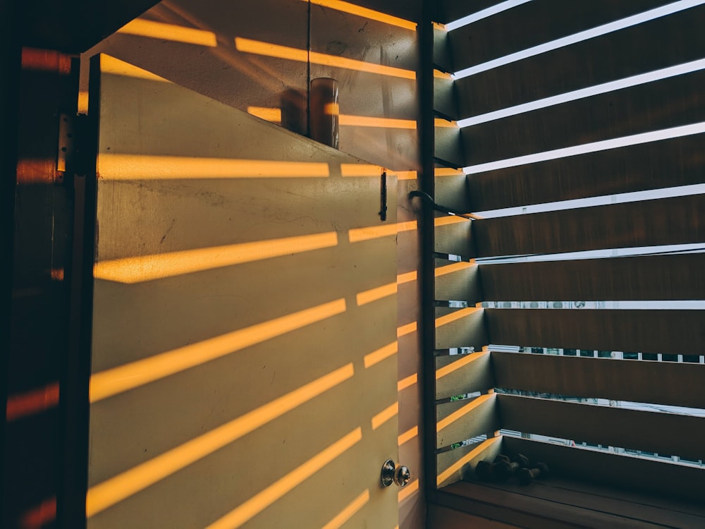 yellow metal staircase with stainless steel railings