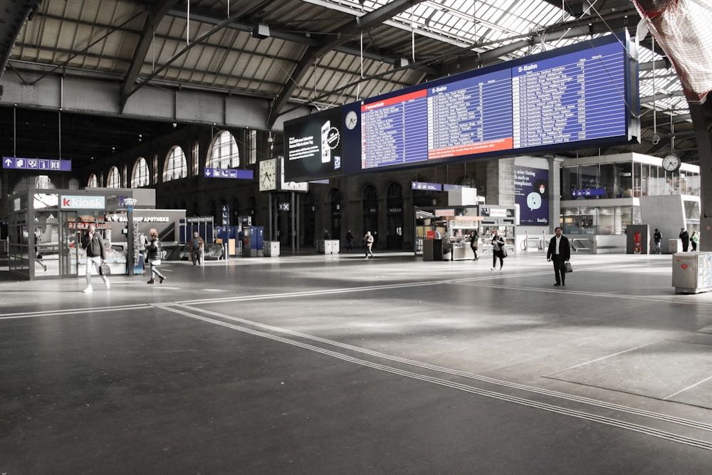 people walking on gray concrete floor