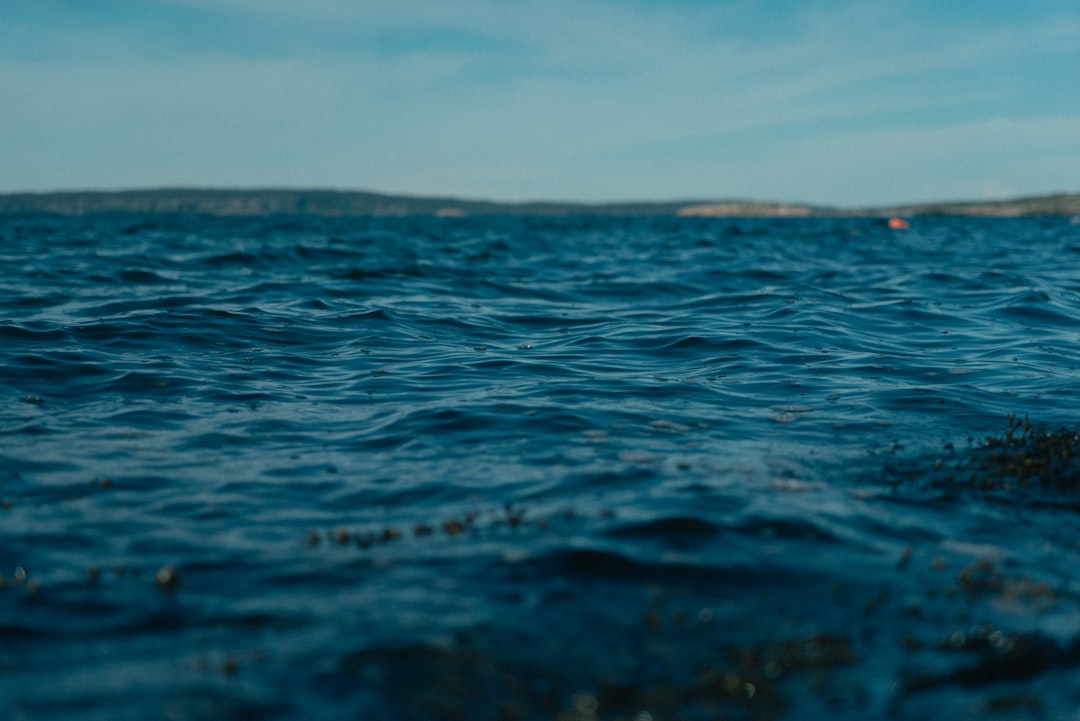 blue ocean water under blue sky during daytime