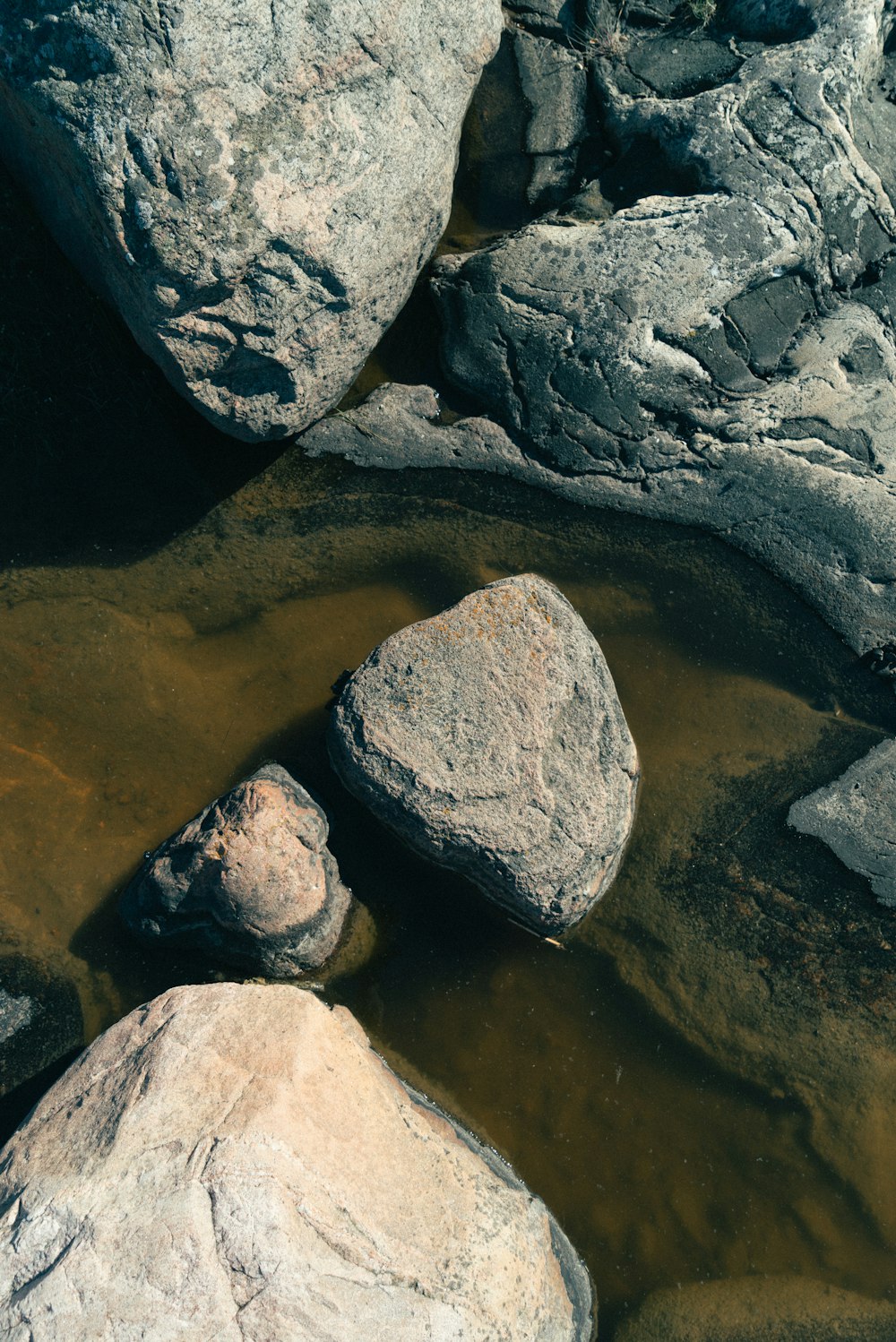 gray and white rock on water