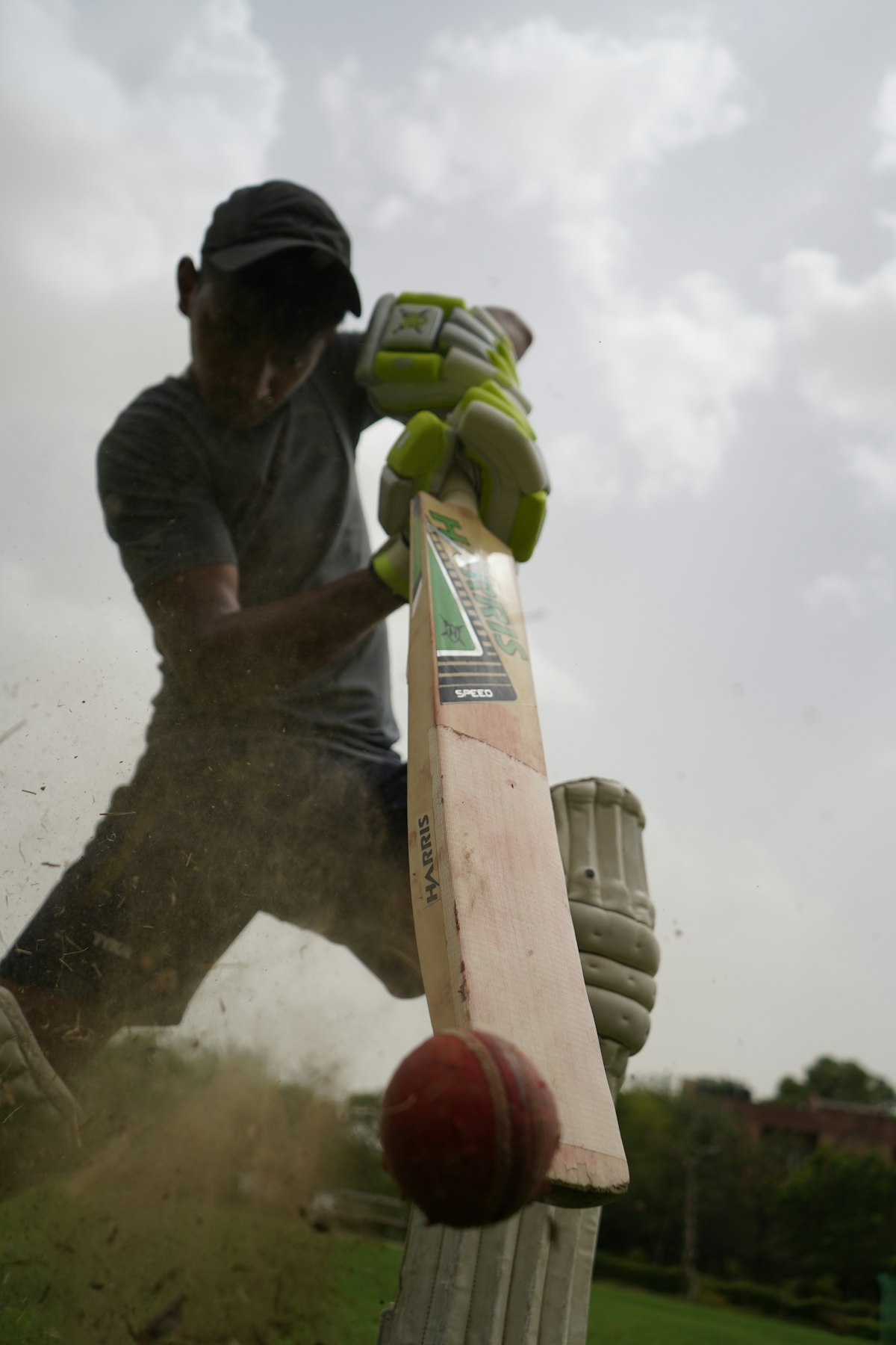 Close-up of a cricket bat in play