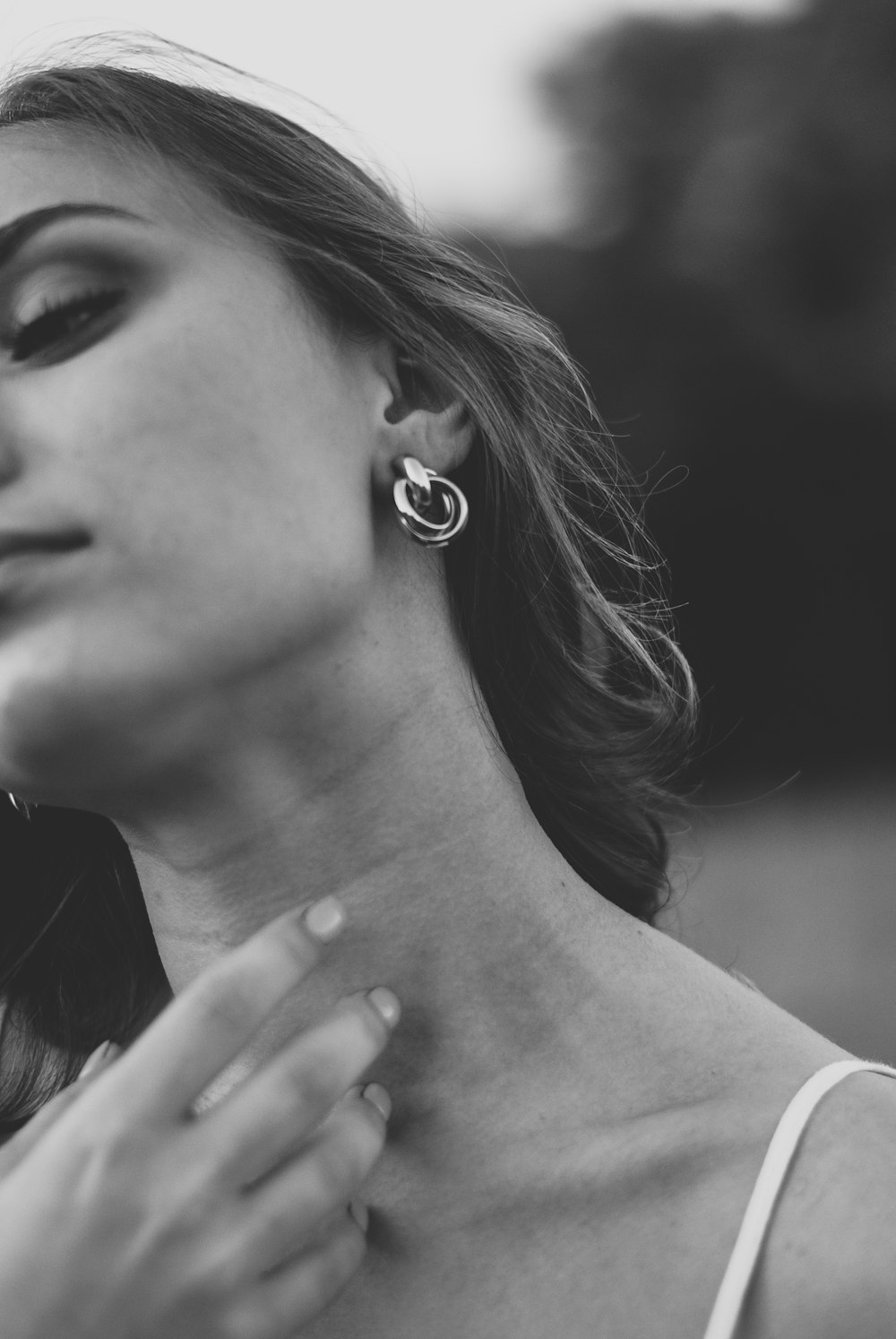 woman wearing silver stud earring