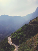 High-altitude perspective illustrating the winding roads weaving through Jogja’s hills.