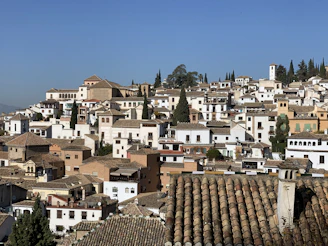 brown and white concrete houses under blue sky during daytime