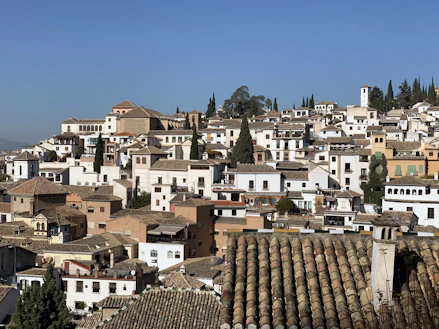 brown and white concrete houses under blue sky during daytime