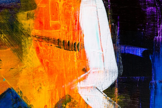 An abstract painting with bold brushstrokes featuring a combination of vivid colors including orange, blue, purple, and white. The texture is rich, with layers of paint applied in varying directions, creating a dynamic and energetic composition. The white streak appears prominently against the darker background, standing out as a central element.