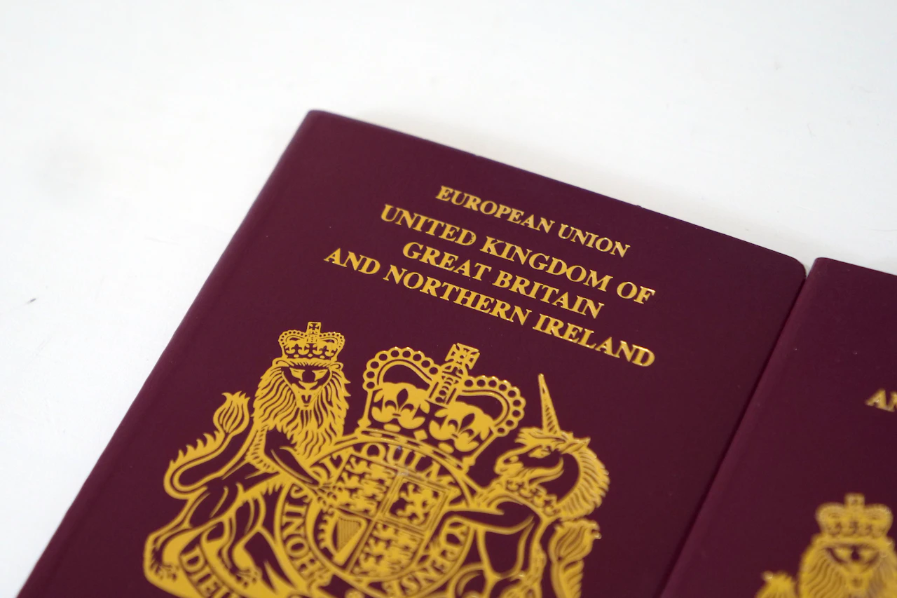 A British passport lying on a plain white table