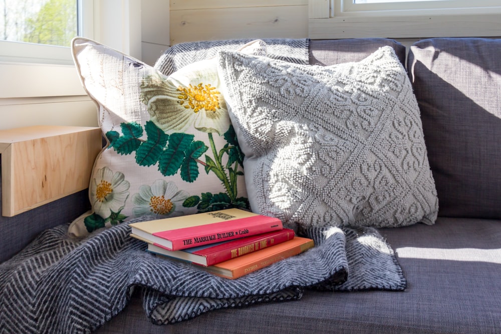 gray and white floral throw pillow