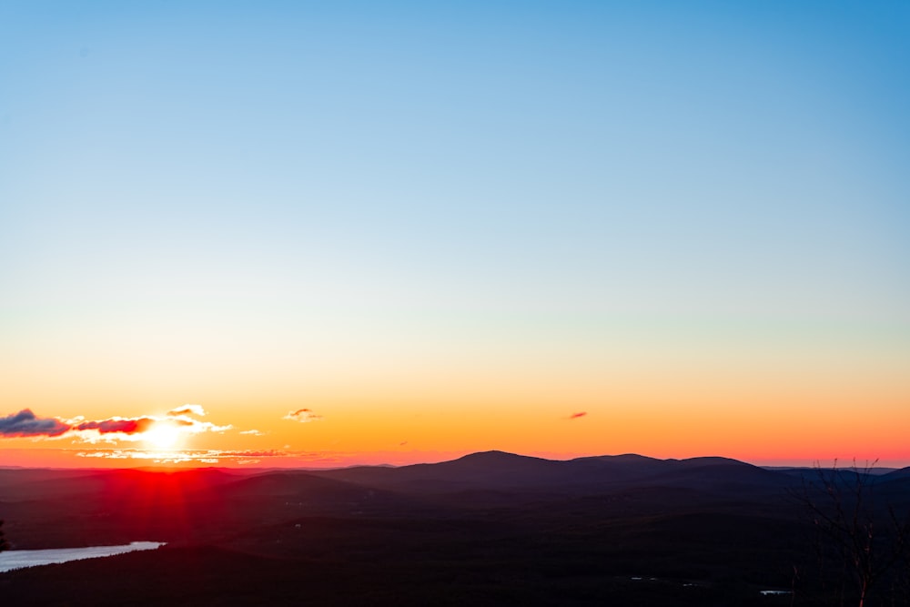 silhouette of mountain during sunset