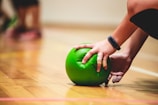 person holding green apple fruit