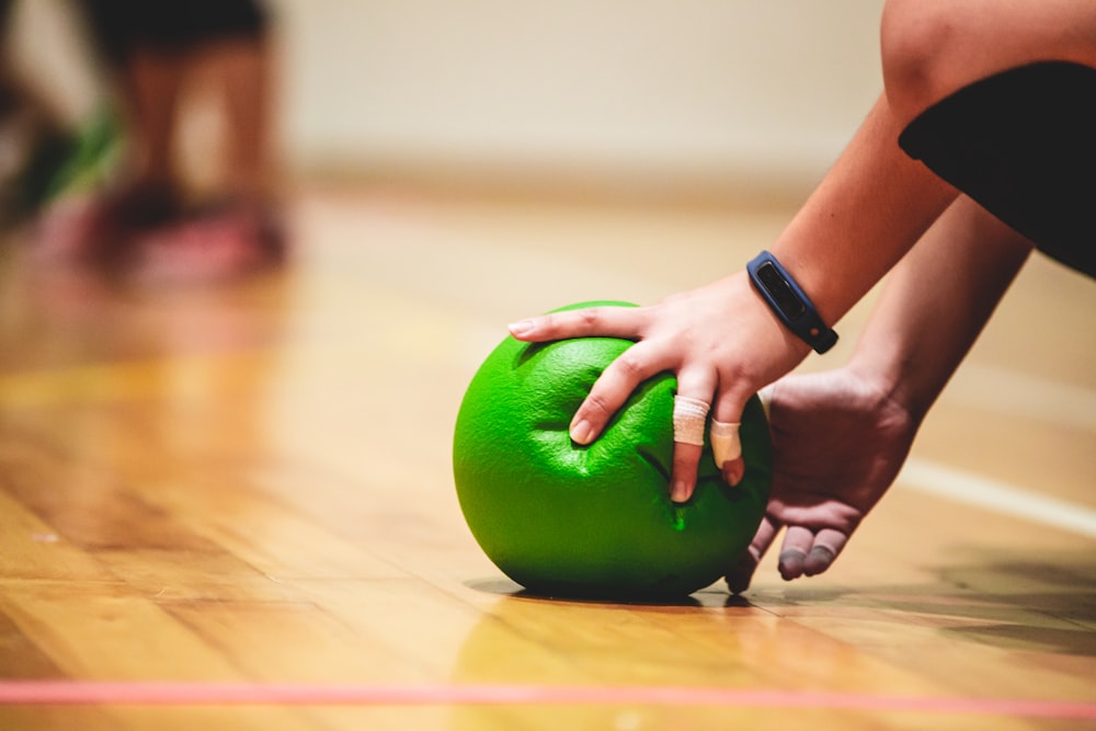 person holding green apple fruit