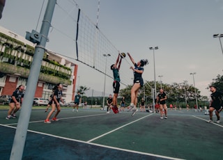 man in black shirt and shorts playing basketball during daytime