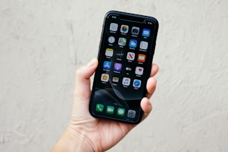 person holding black iphone 5