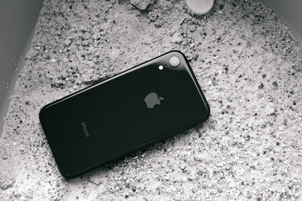 black iphone 7 plus on gray marble table