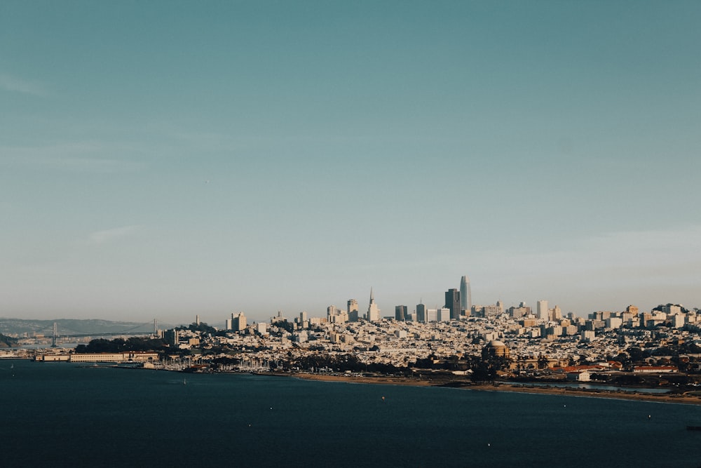 city skyline under blue sky during daytime