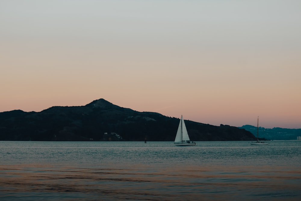 white sailboat on sea during daytime