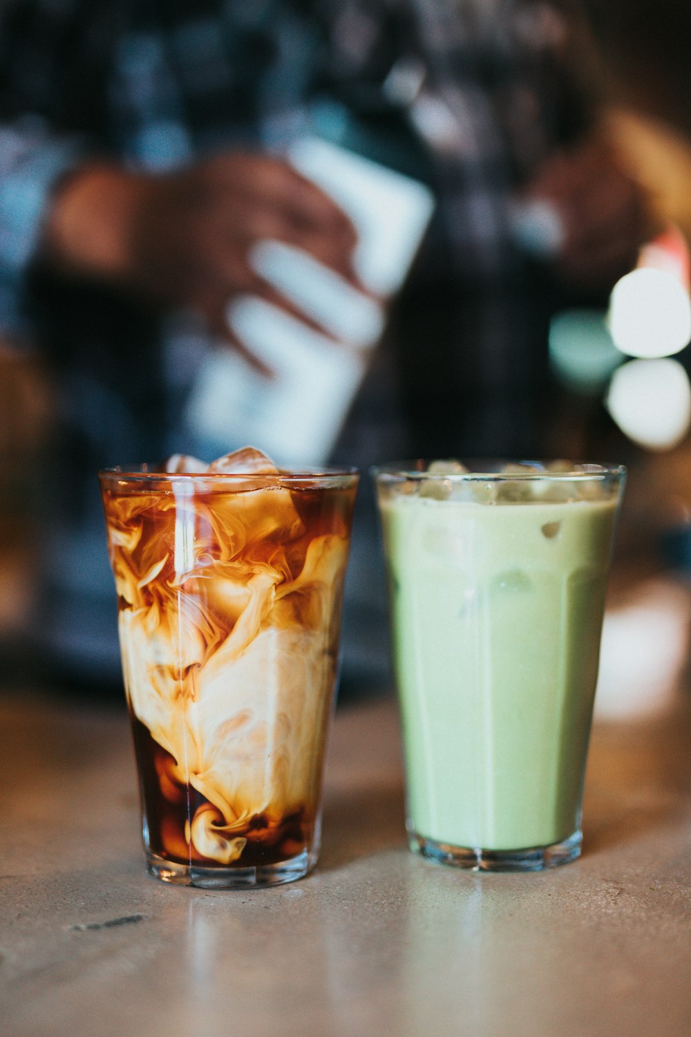 clear drinking glass with brown liquid