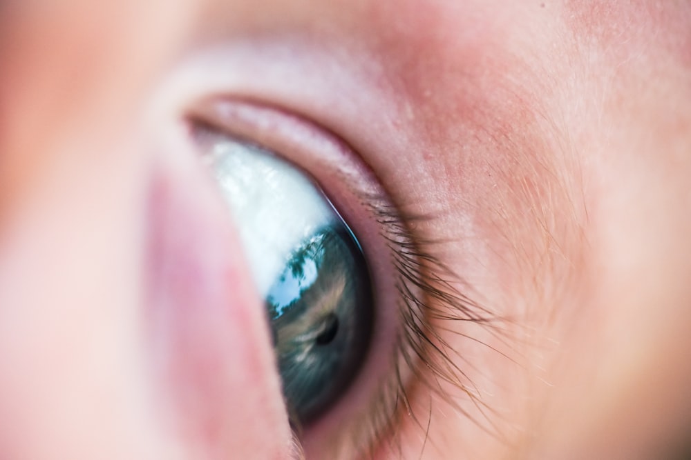 persons eye with blue eyes