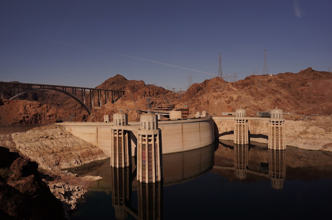white and brown concrete bridge under blue sky during daytime, Hoover Dam