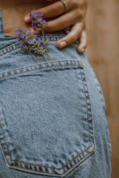 person in blue denim jeans