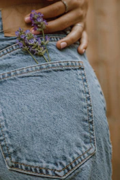 person in blue denim jeans