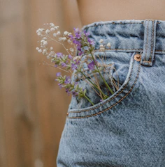 purple flower on blue denim shorts