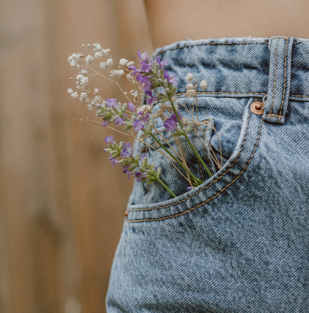 purple flower on blue denim shorts