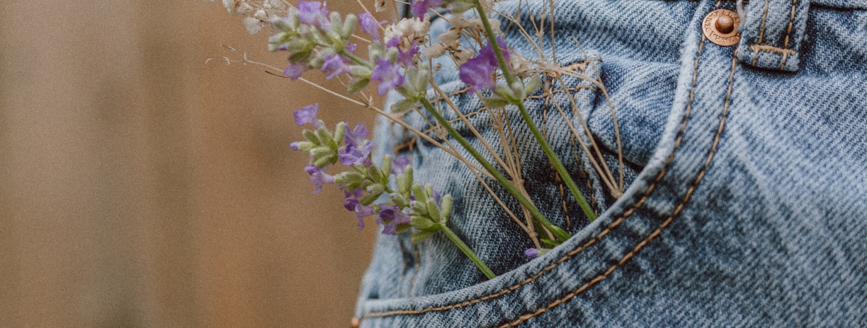 purple flower on blue denim shorts