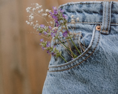 purple flower on blue denim shorts