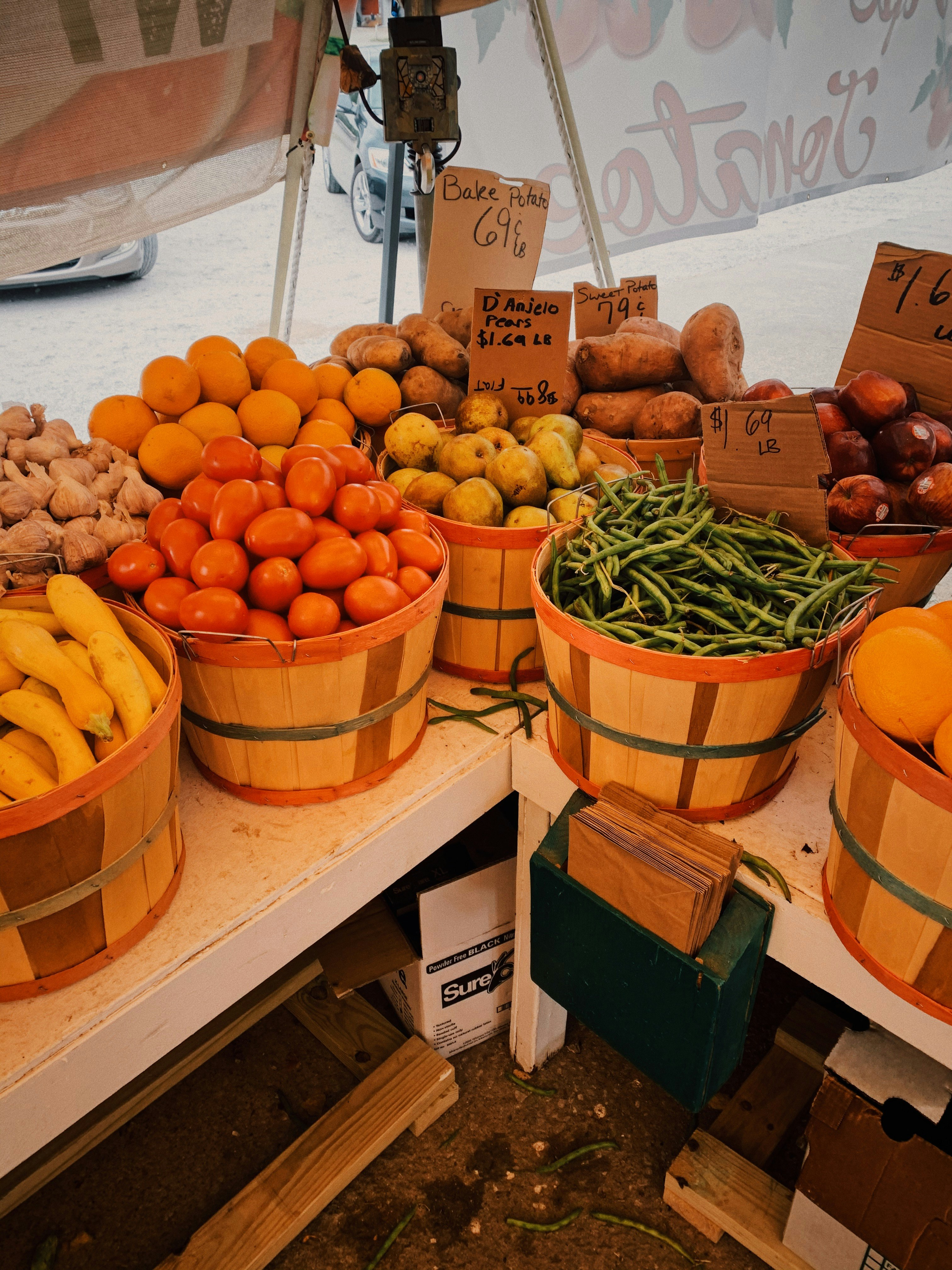 orange fruits on brown wooden crate