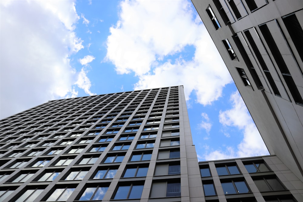 white and black concrete building under blue sky during daytime