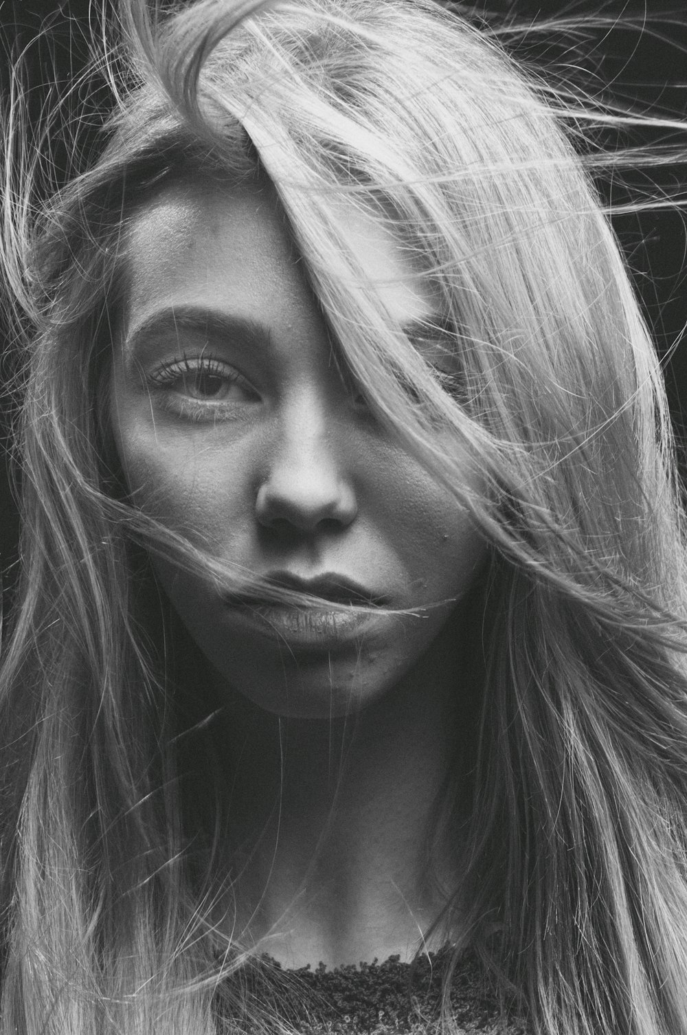 grayscale photo of womans face