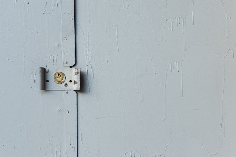white wooden door with padlock