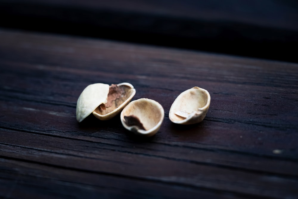 white and brown heart shaped stones on brown wooden table