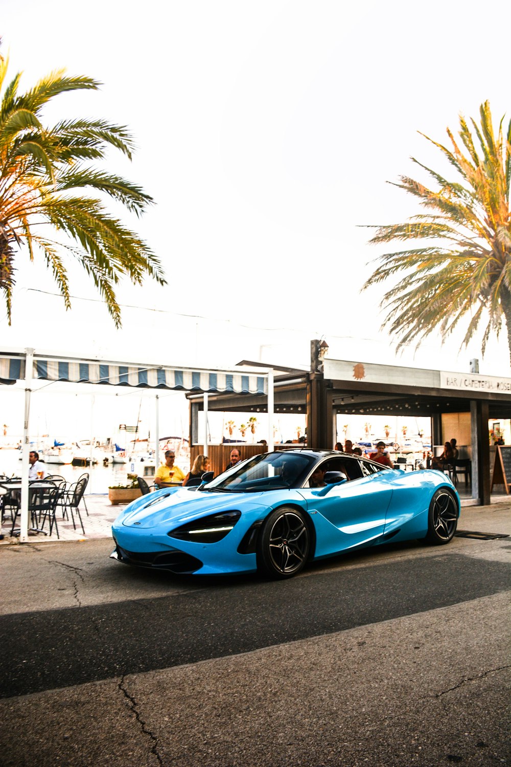 blue ferrari 458 italia parked on street during daytime