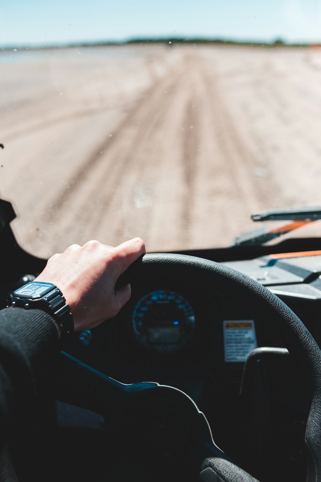 person driving car during daytime