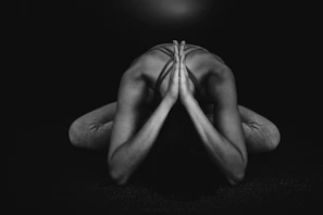 grayscale photo of naked man