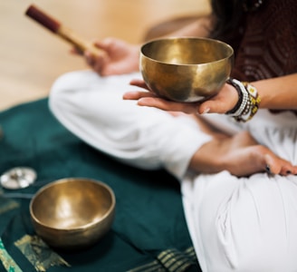 person in white dress shirt holding brown wooden chopsticks