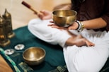 person in white dress shirt holding brown wooden chopsticks
