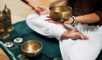 person in white dress shirt holding brown wooden chopsticks